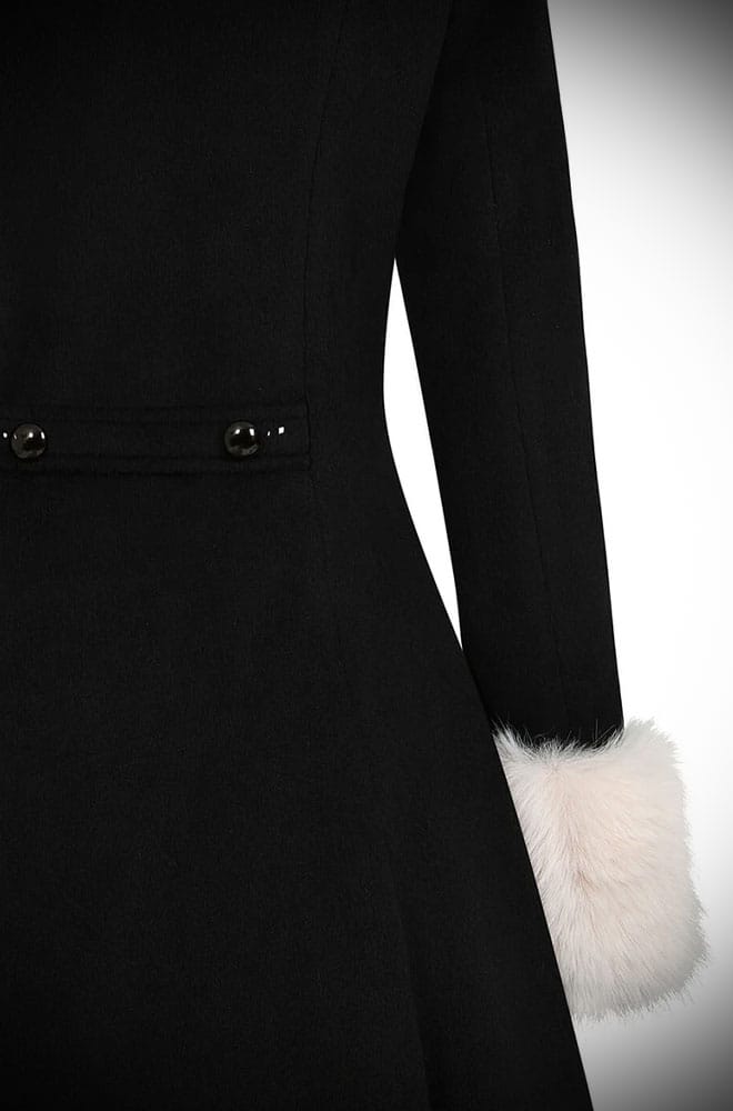 The glamour! The Fur Collar Swing Coat is a stunning vintage-inspired coat in black with luxurious ivory fur at the collar and cuffs. 