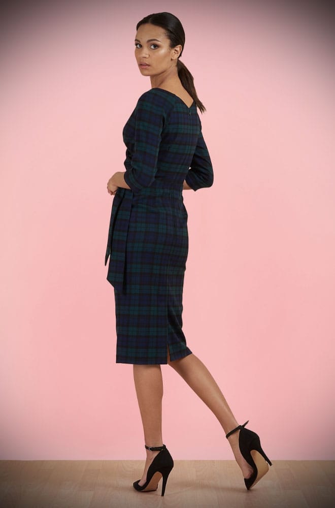 The Tartan Hourglass Pencil Dress is timeless but with plenty of sass. This chic dress features a faux wrap bodice, cinched waist, fitted pencil skirt with flattering waist pleats and, a faux side tie.